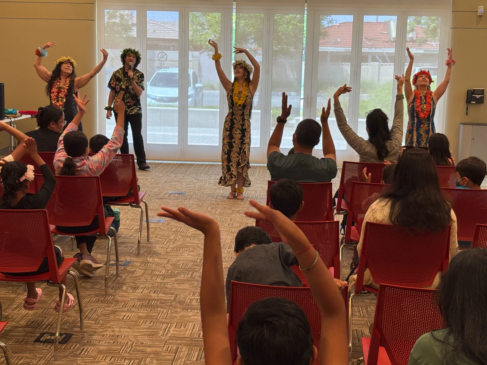 Performers and families enjoying Echoes of Polynesia at Artesia Library